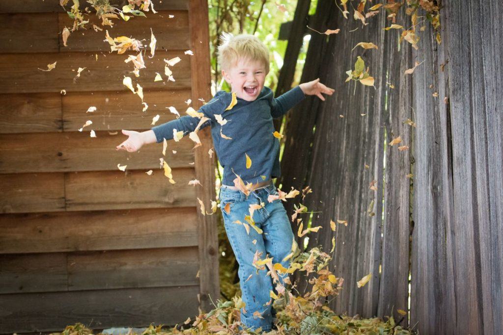 Kid Running Through Leaves